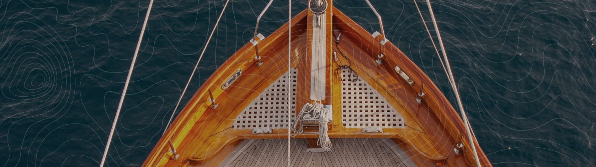 Teak grating on sailing yacht at sea